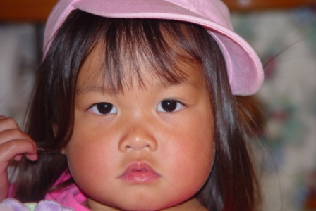 Kasen in her pink ball cap